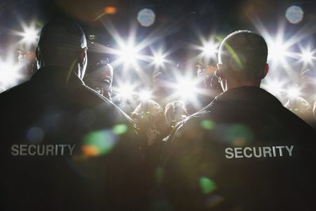 Security guards blocking paparazzi